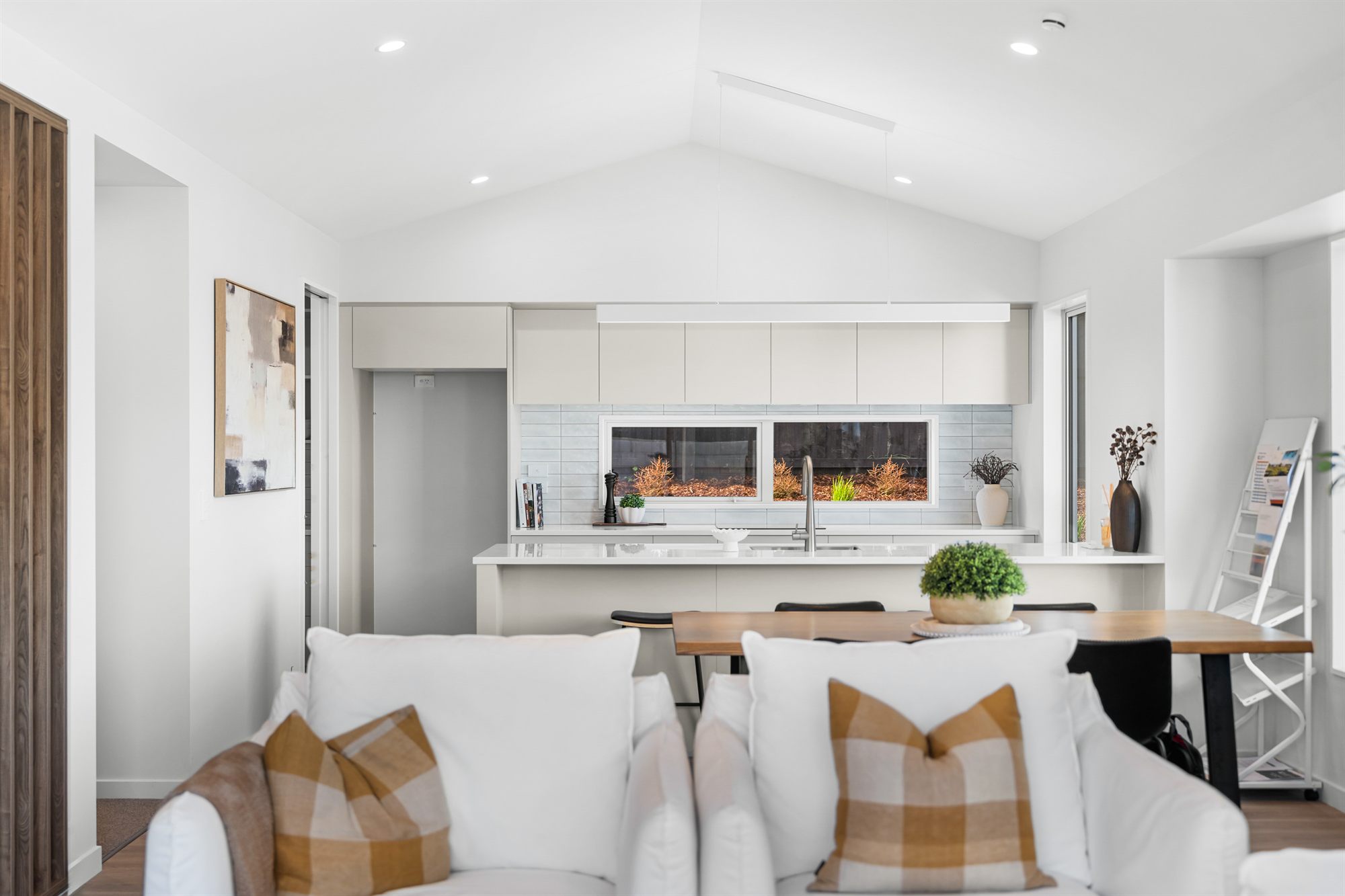 Open-plan Trendz kitchen with island bench and dining